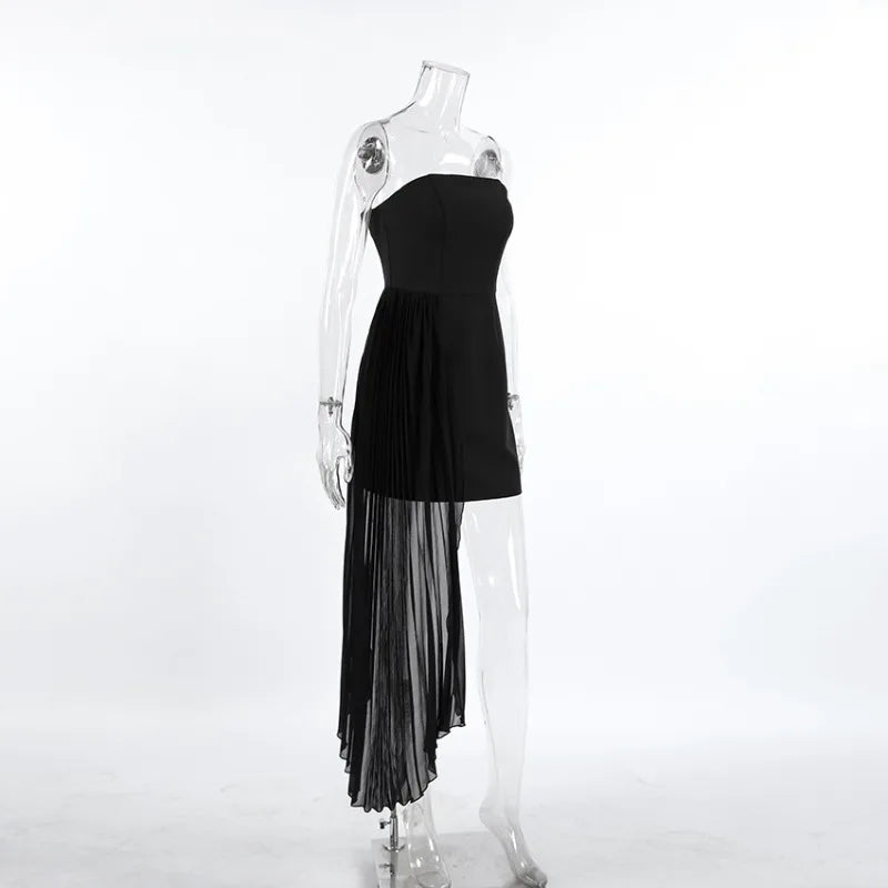 Black strapless dress with sheer overlay on a mannequin against a white background