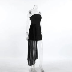 Black strapless dress with sheer overlay on a mannequin against a white background