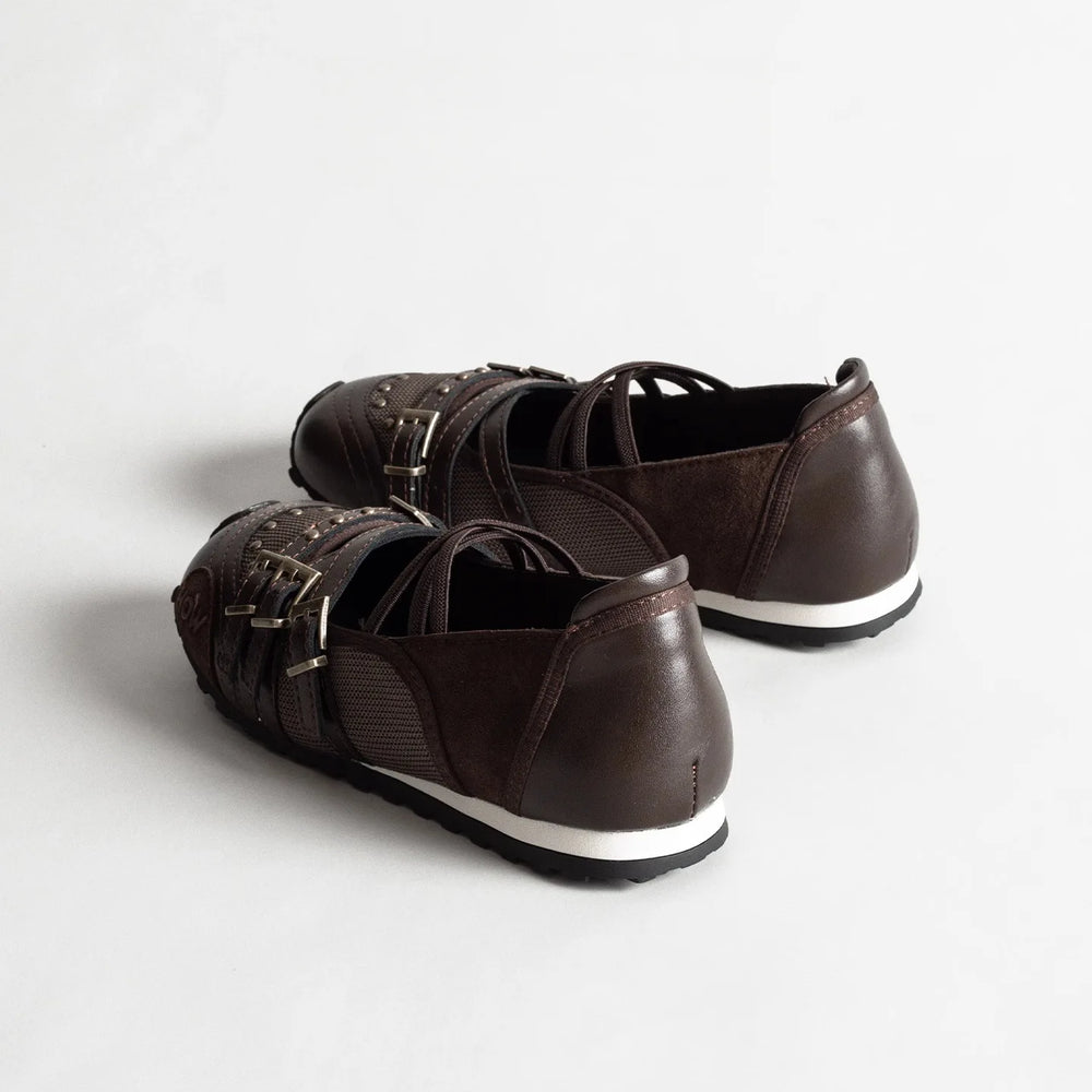 Rear view of brown buckle strap round toe flats