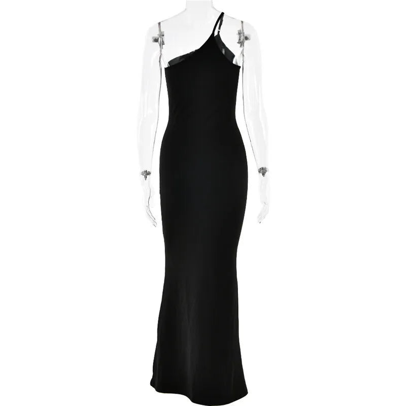 Black evening gown on a mannequin against a white background