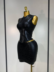 Black mock neck sleeveless top and mini skirt set side profile