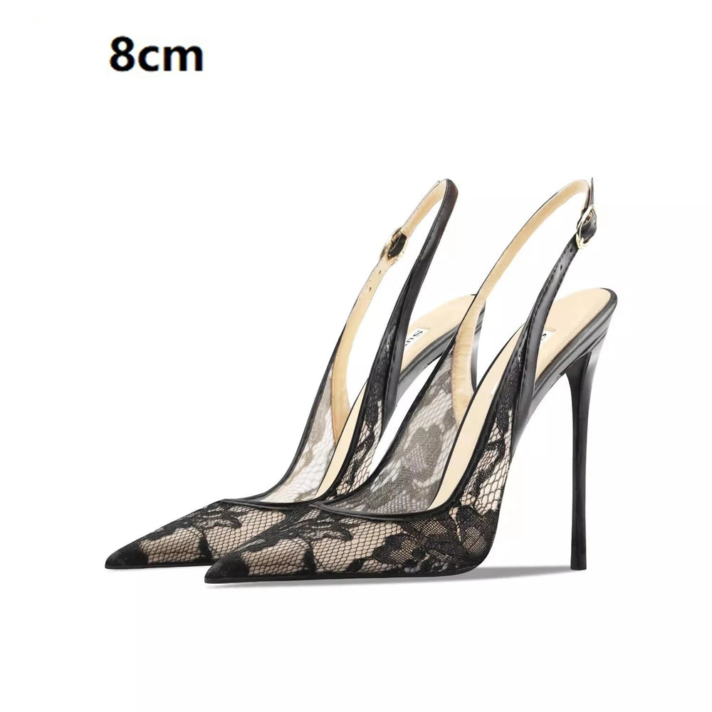Black lace high-heeled shoes on a white background