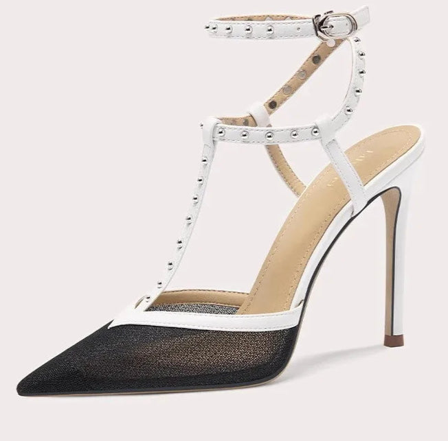High-heeled shoe with white strap and black mesh sole on a light gray background
