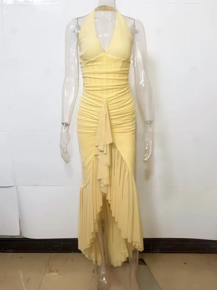 Yellow dress on a mannequin against a white background