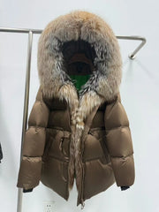 Brown puffer jacket with fur hood on a rack against a white background