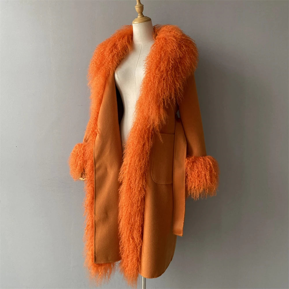 Orange fur-trimmed coat on a mannequin against a gray background