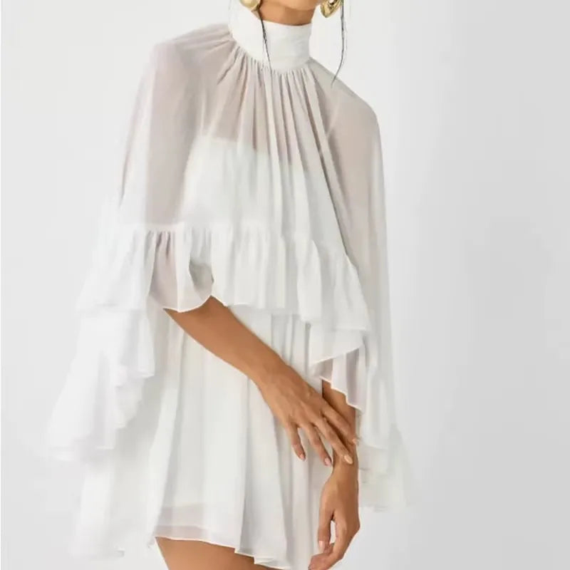 White and beige layered dress on a white background