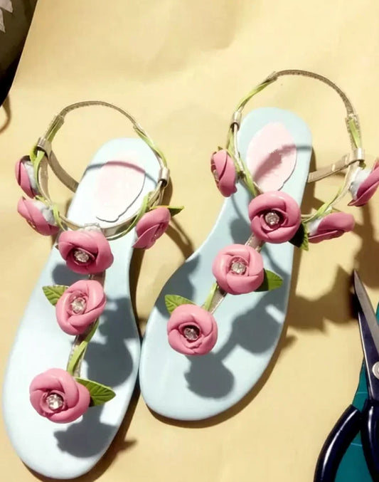 Floral thong slingback flat sandals with pink rose and green leaf details