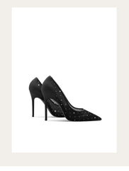 Black high-heeled shoes with studded details on a white background