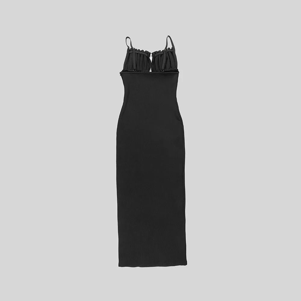 Black dress with thin straps on a light gray background