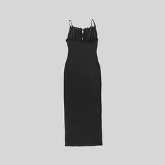 Black dress with thin straps on a light gray background