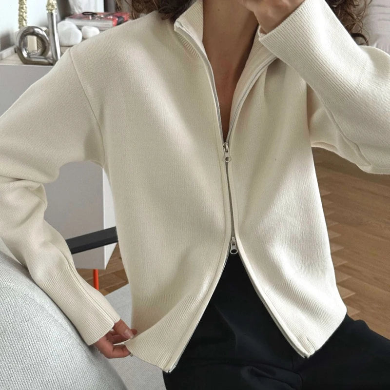 White zip-front stand collar knit jacket detail
