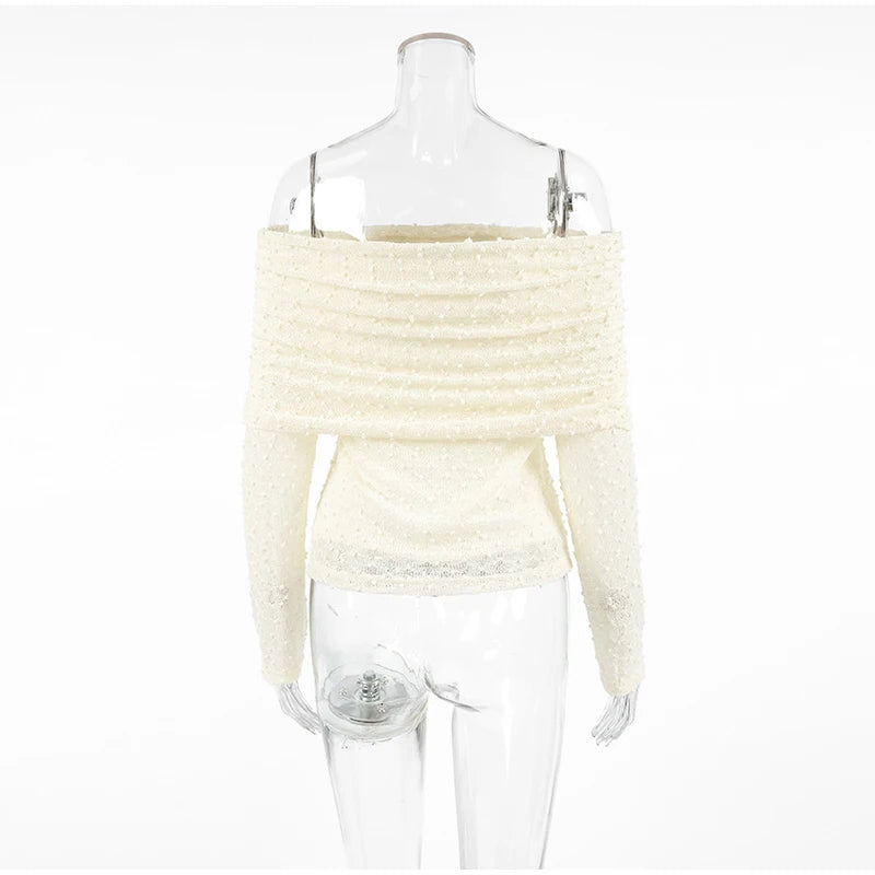 White off-shoulder sweater on a mannequin against a white background
