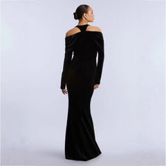 Back view of black velvet off-shoulder deep v-neck fishtail evening dress