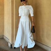 Chic white two-piece set with lantern sleeve blouse and high-waist skirt
