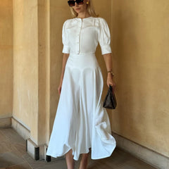 Chic white two-piece set with lantern sleeve blouse and high-waist skirt