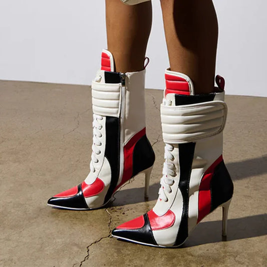 Patchwork high heel ankle boots in red, black, and white.