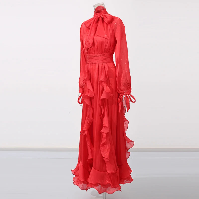Red evening gown on a mannequin against a white background
