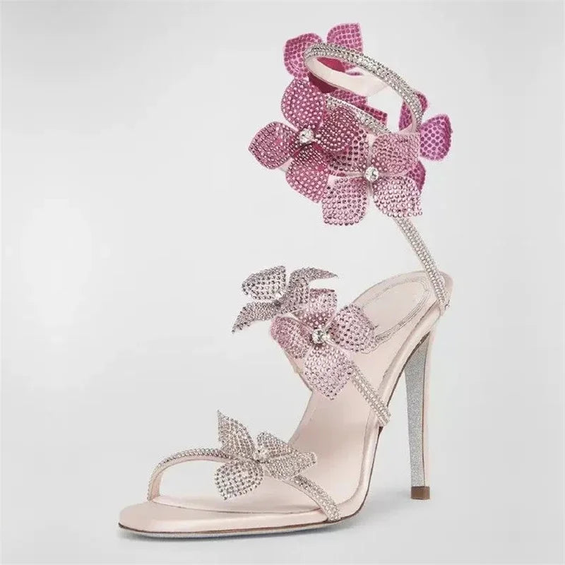 Side profile of a pink crystal flower ankle strap stiletto heel