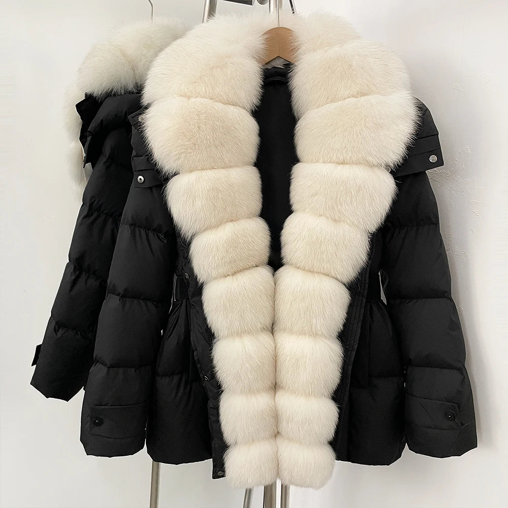 Black puffer jacket with a long white fur collar on a mannequin