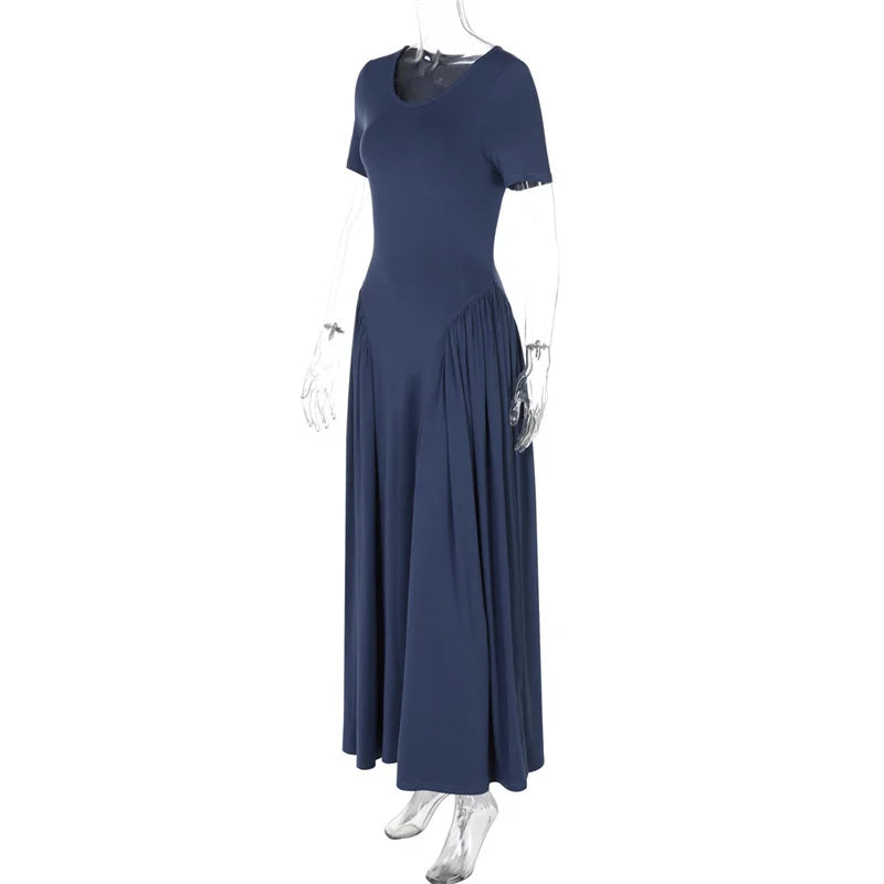 Navy blue dress on a mannequin against a white background