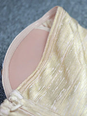 Close-up of a beige garment with a textured surface
