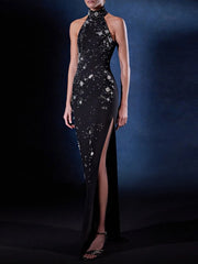 Black evening gown with star patterns on a dark background
