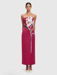 Strapless column maxi dress with floral appliqué detail.