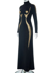 Black dress with gold abstract patterns on a white background