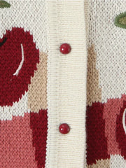 Close-up of a knitted fabric with red and beige pattern and buttons.