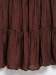 Close-up of a maroon curtain with ruffled layers