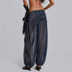 Side view of dark grey mesh harem trousers with a rhinestone waistband