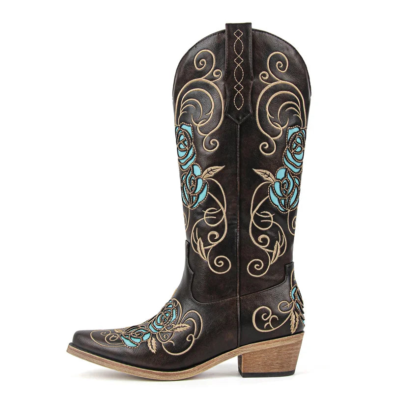 Brown cowboy boot with turquoise and gold embroidery on a white background