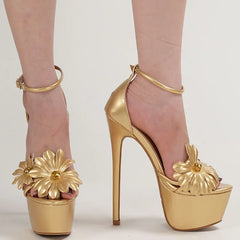 Gold high-heeled shoes with floral designs