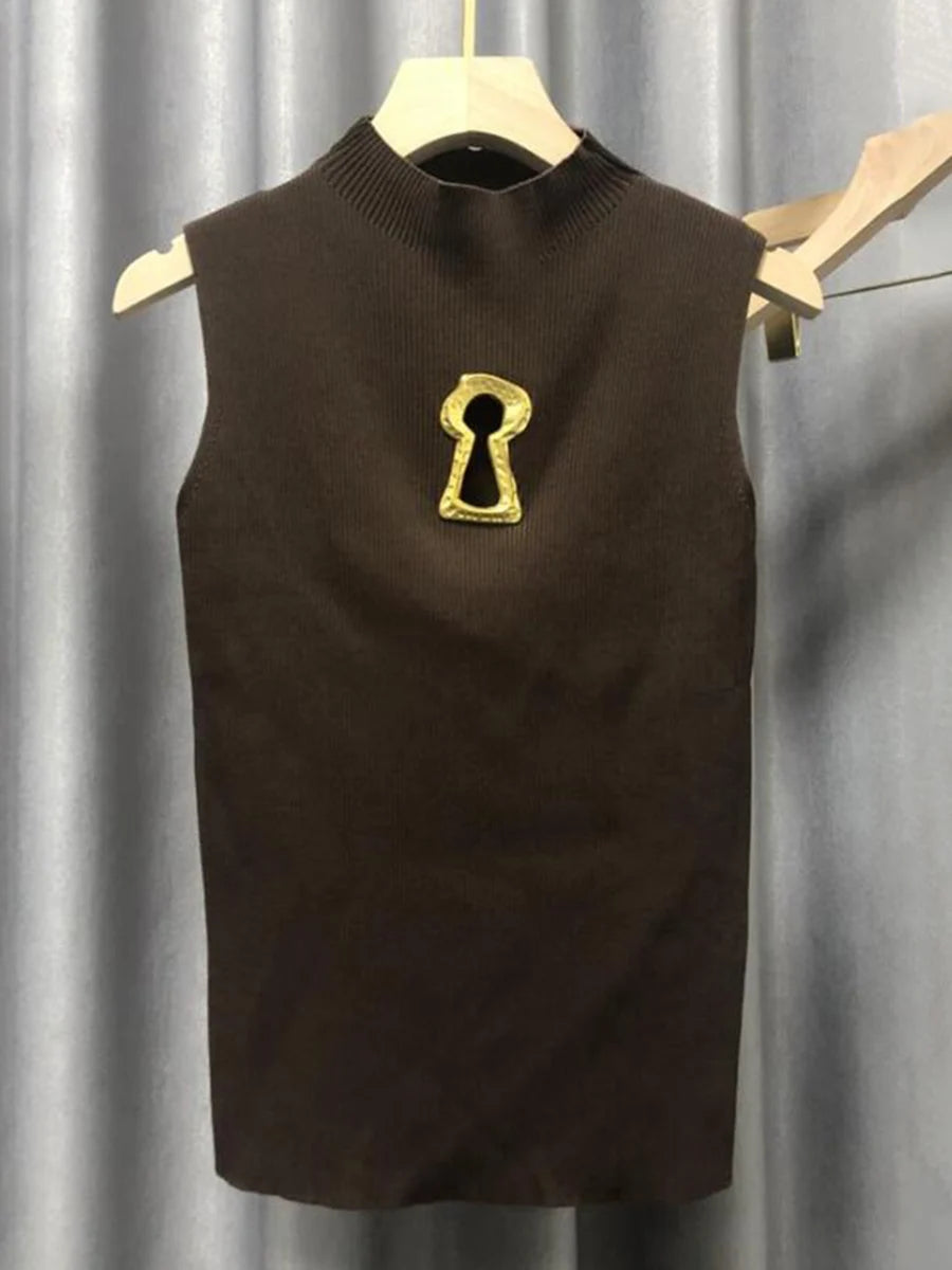 Brown sleeveless sweater with a gold keyhole design on a gray background