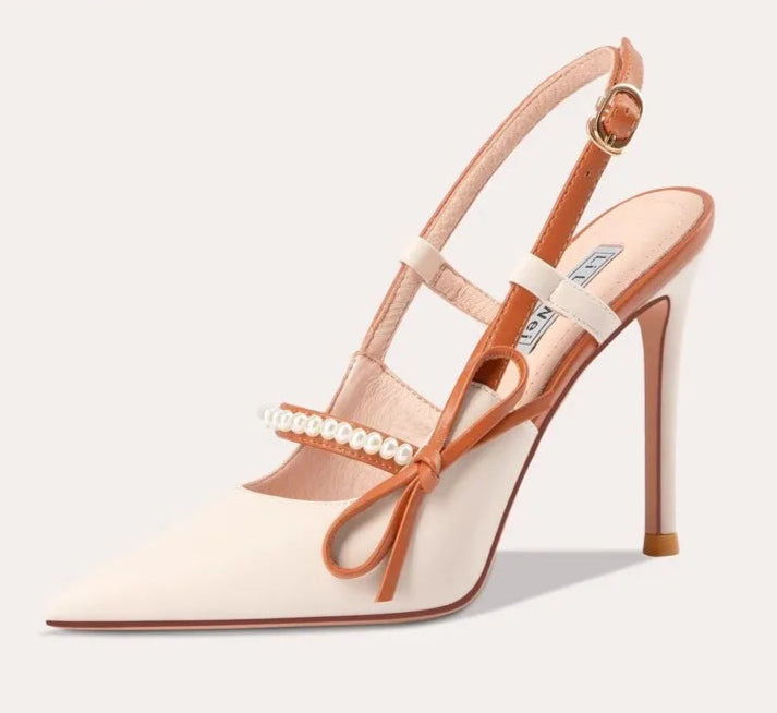 High-heeled sandal with bow detail on a white background