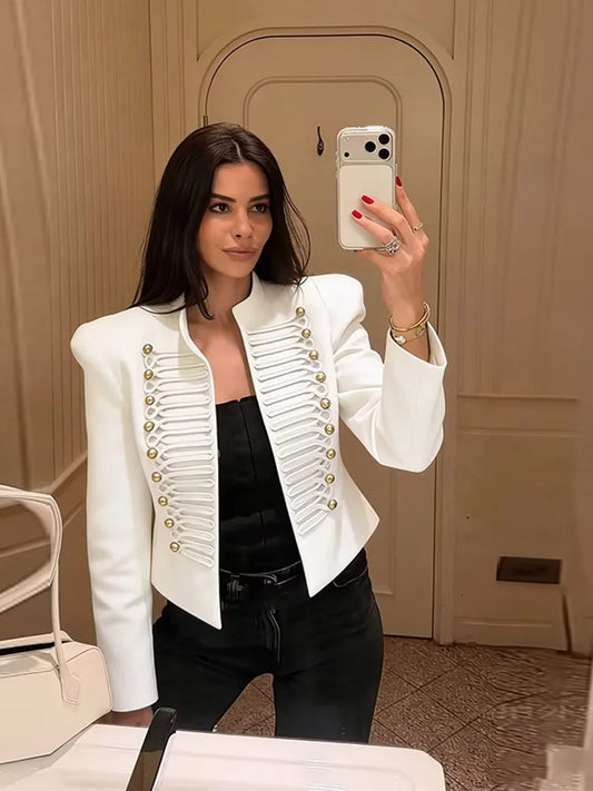 White cropped military style jacket with gold buttons and cord braiding