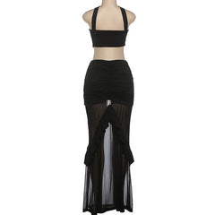Black halter top and ruched skirt set on a mannequin against a white background