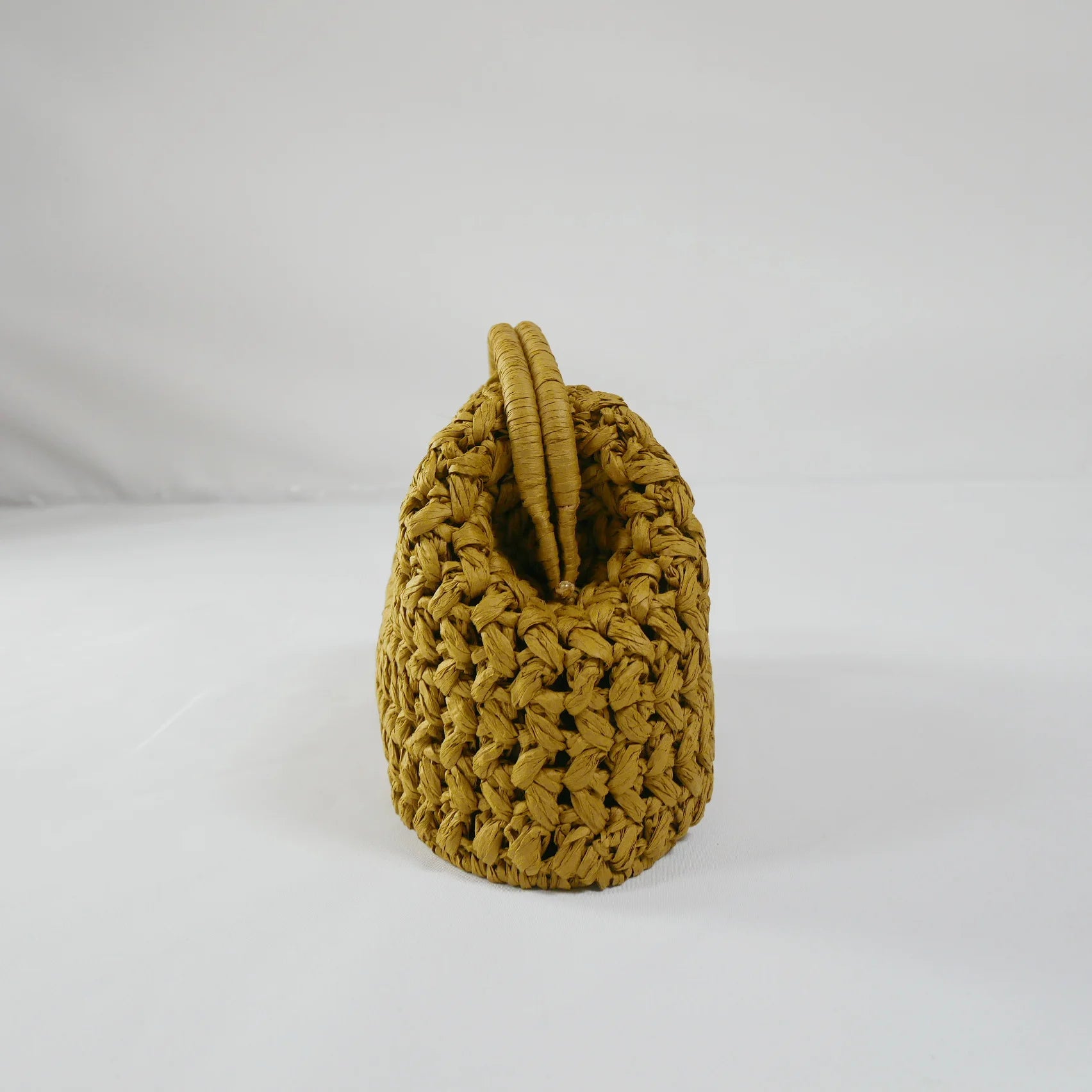 Handcrafted straw handbag with rustic charm and versatile design