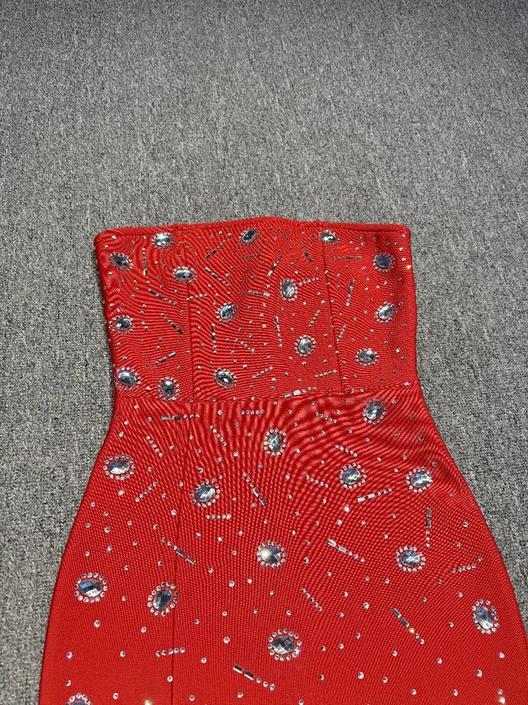 Red strapless top with silver embellishments on a gray surface