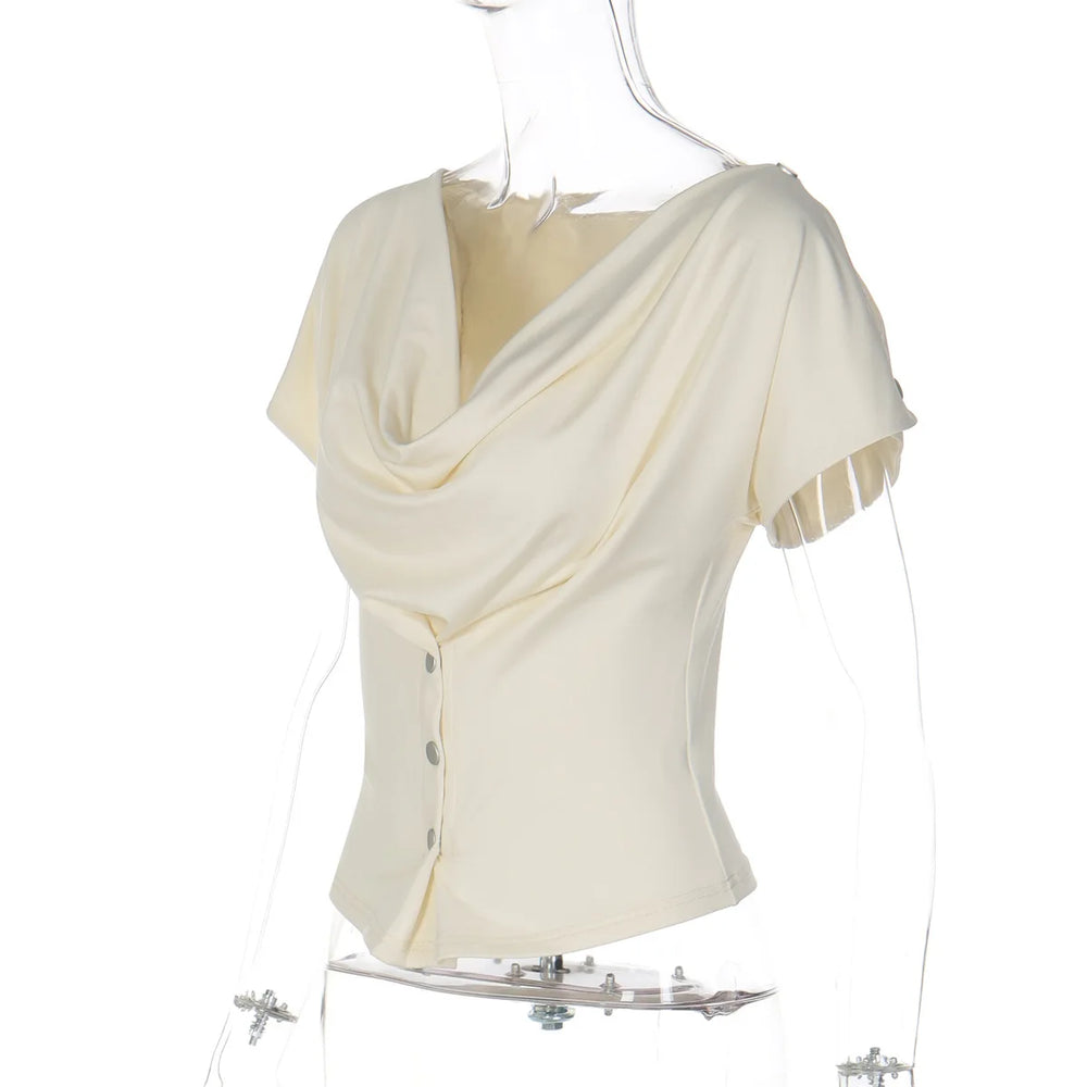 White blouse with draped design on a mannequin against a white background