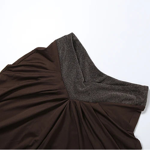 Brown dress with a textured strap on a white background