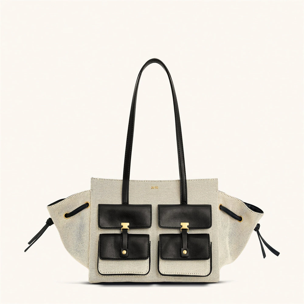 Designer handbag with black and gold accents on a white background