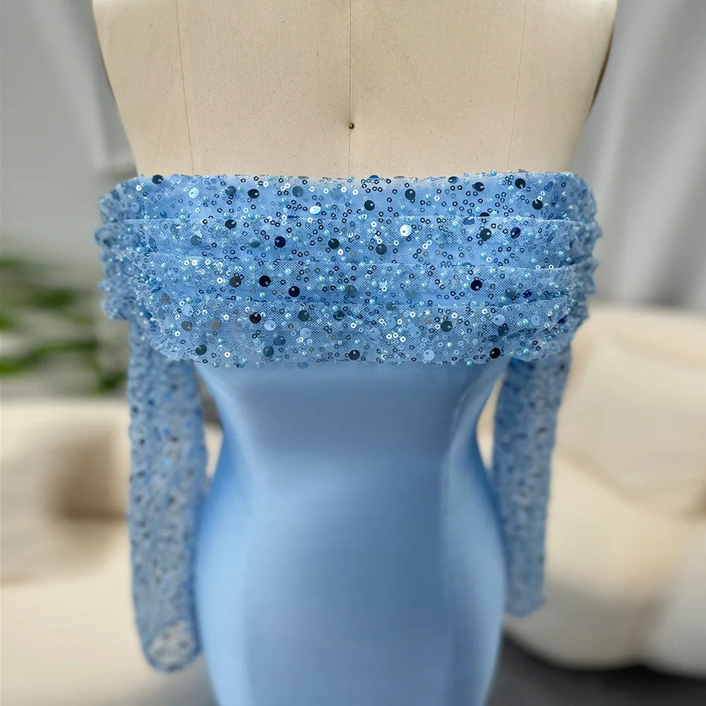 Blue sequined top on a mannequin with a blurred background