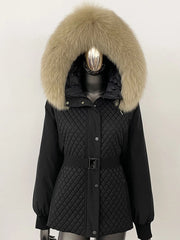 Black quilted parka with large fur hood on a mannequin against a white background