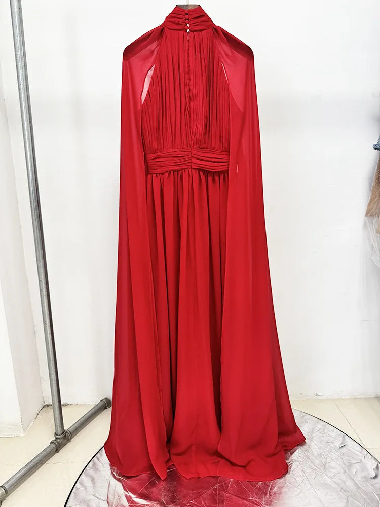 Red chiffon cape dress hanging
