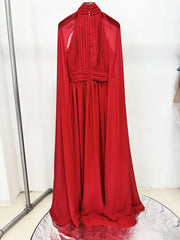 Red chiffon cape dress hanging