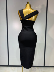 Black strapless sheath midi dress with hollow out detail.