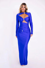 Woman wearing a blue evening gown with cut-out design on a white background