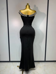 Back view of an off-the-shoulder draped bandage dress with diamond embellishments